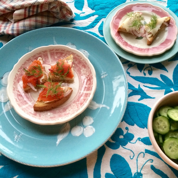 Cold smoked salmon (left) and cold smoked black cod (upper right) with toast, cream cheese, thinly sliced red onion, and fresh dill.