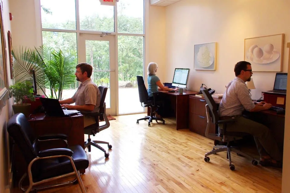 Interior image of Cake's Lexington Avenue office in Asheville, NC featuring staff working at computers