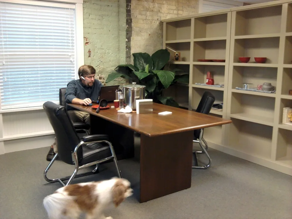 Cake's Magnolia Street office in Asheville, NC featuring Clark working at his computer